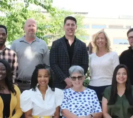 Group of people standing among trees