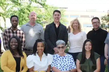 Group of people standing among trees